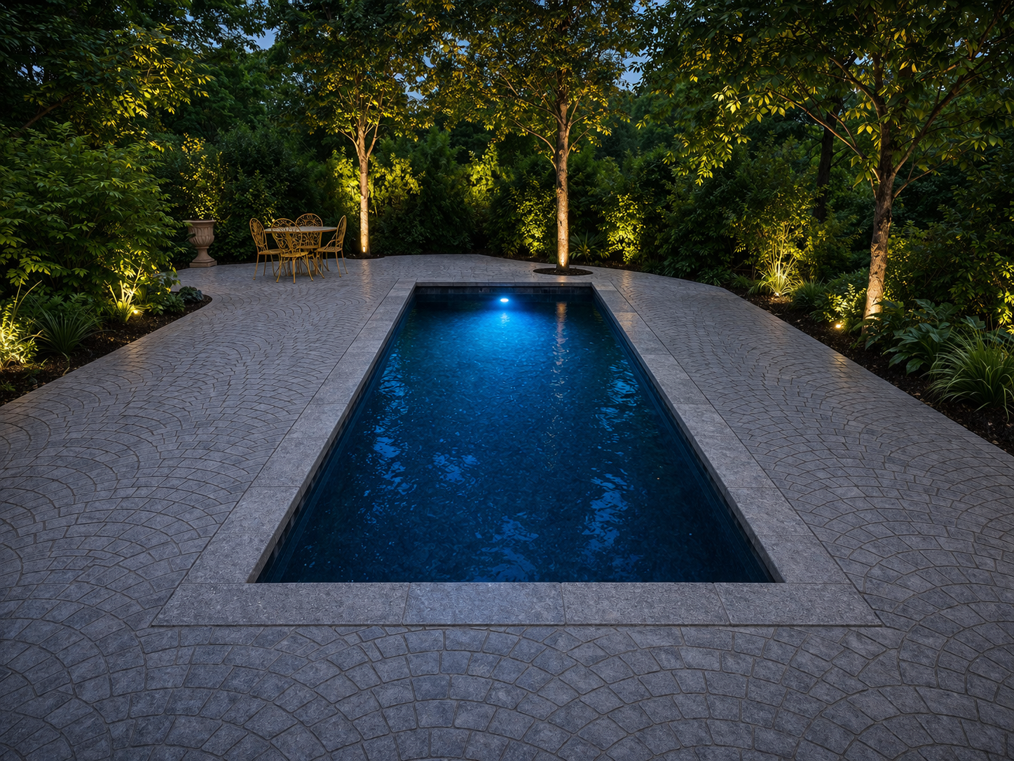 Aerial view of pool with landscape lighting at night