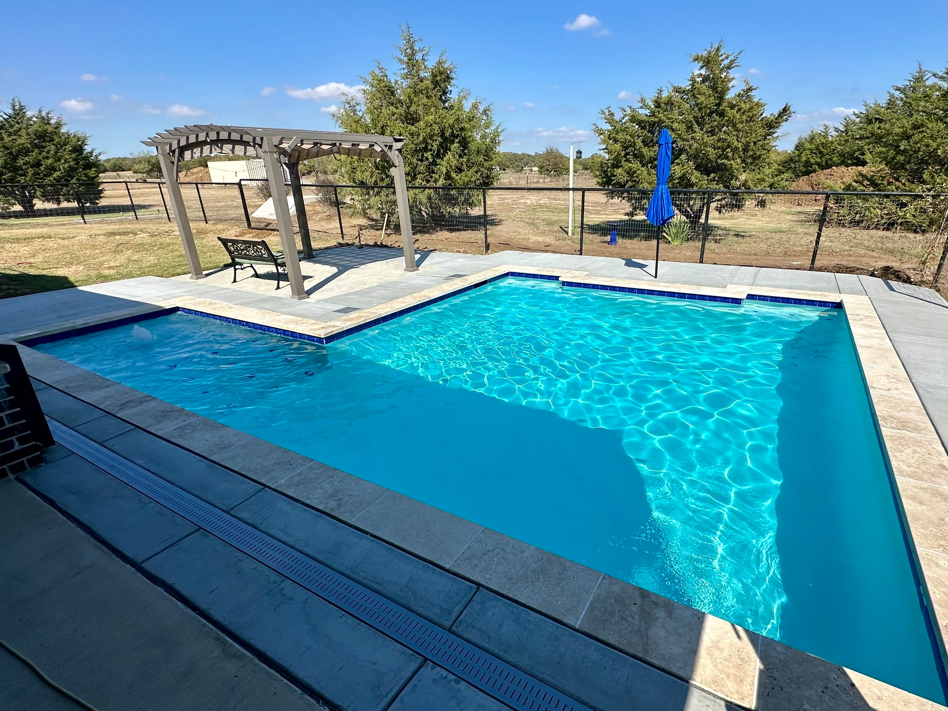 Pool with pergola on a ranch property
